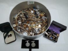 A large selection of gent's cufflinks and tie slides of various forms