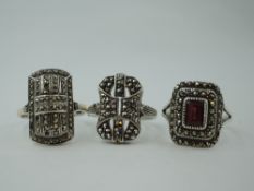 Three silver and white metal marcasite dress rings