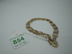 A 9ct gold four bar gate bracelet having padlock clasp, approx 5.4g