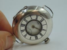 A 1920's silver top wound half hunter pocket watch converted to use with wrist strap, having Roman