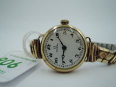 A lady's 9ct gold vintage wrist watch by Omega, no: 9117101, having an Arabic numeral dial to