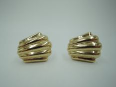 A pair of American 14ct gold clip earrings in moulded scalloped form, approx 5.7g