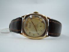 A vintage 9ct gold wrist watch by Helvetia having Arabic numeral dial with subsidiary seconds to