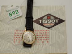 A lady's 1960's 9ct gold wrist watch by Tissot having Arabic numeral dial in a gold case on a