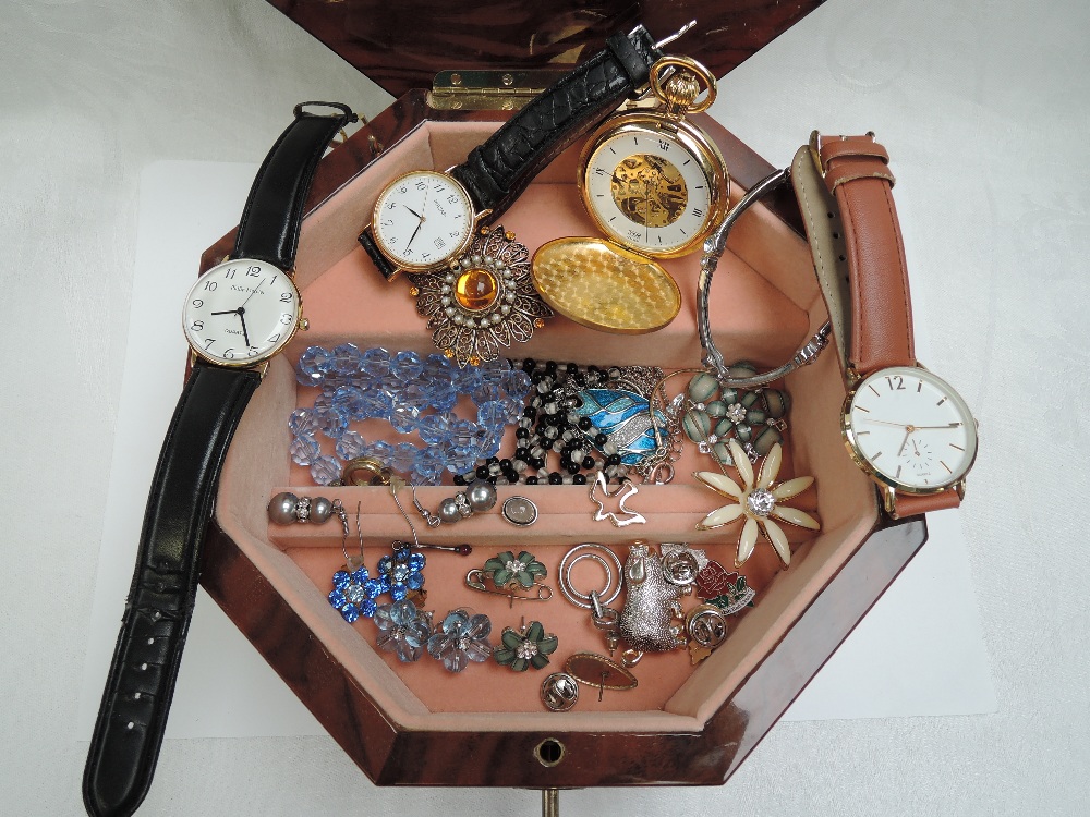 An Italian musical wooden jewellery box of octagonal form containing a small selection of costume