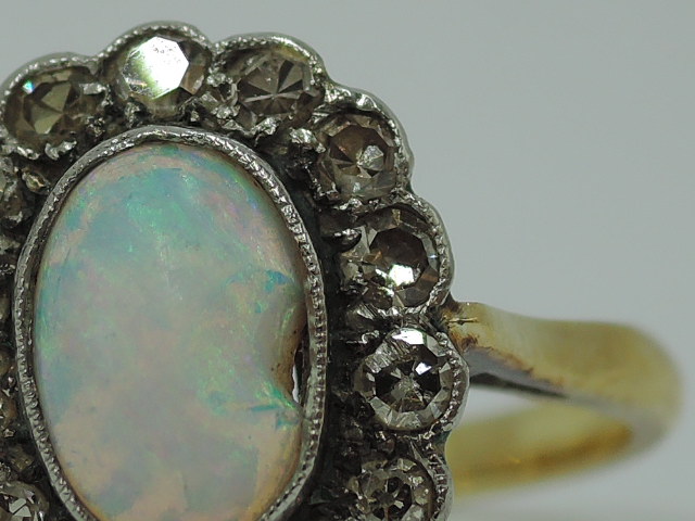 An opal and diamond cluster in a collared basket mount on a yellow metal loop stamped 18ct, size P & - Image 4 of 4