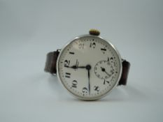 An early 20th Century silver trench wrist watch by JW Benson having Arabic numeral dial with