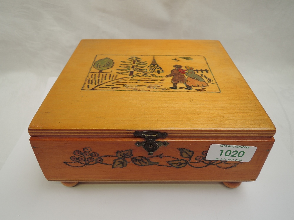 A wooden box containing a selection of brooches including enamelled, ceramic, Scottish, Marcasitte