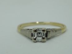 A princess cut diamond solitaire dress ring, approx 0.25ct in a white and yellow metal mount and