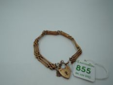 A 9ct rose gold three bar gate bracelet having padlock clasp, approx 7.5g