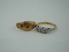 A diamond trilogy ring in an illusionary mount on a yellow metal loop stamped 18ct & plat, and an