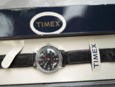 A 1970's military style wrist watch by Timex having Arabic 24hr numeral dial to black face in
