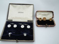 A cased set of two 9ct gold collar studs and a yellow metal dress collar stud stamped 18ct with