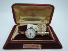 A vintage 9ct gold Rolex wrist watch having Arabic numeral dial with perimeter gilt dot dial to