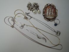 Four white metal pendants and chains stamped 925, a large pinchbeck cameo brooch, a dress ring and a