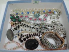A selection of mainly vintage jewellery including strings of cut glass beads, diamante, mourning
