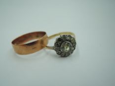 A 9ct rose gold wedding band, size P and a paste daisy cluster dress ring in a white metal mount