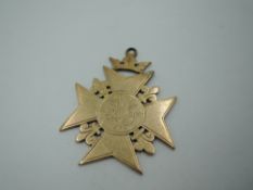 A Victorian yellow metal medalion having presentation inscription regarding a military team match,