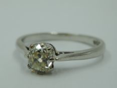 A diamond solitaire ring, approx 0.5ct in a claw set mount to knife blade shoulders on a platinum