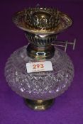 A well formed small size late Victorian oil burning lamp by Vereds having cut glass well