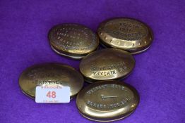 Five brass cast snuff or pill case including Long Green and Bristol