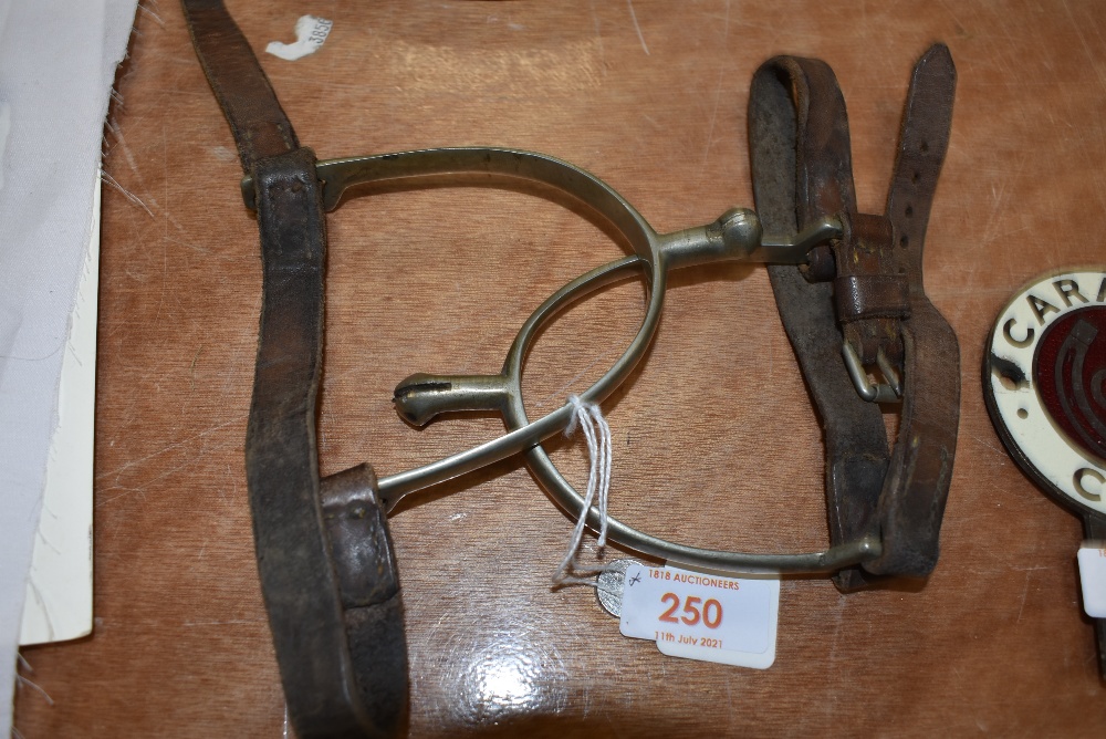 A pair of vintage leather and metal spurs.