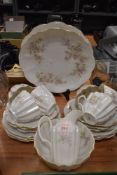 A collection of vintage cups and saucers, plates, bowl and jug having dainty floral pattern and