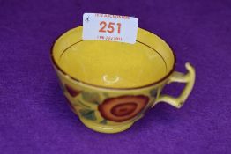 A small yellow glazed antique tea cup