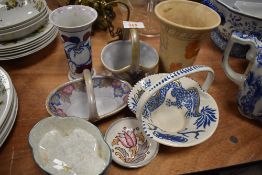 A collection of ceramics predominantly Charlotte Rhead designs including posy baskets vases and