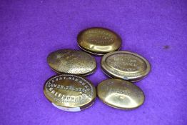 Five brass cast snuff or pill case late Victorian including Chippenham Llangeitho Festiniog and