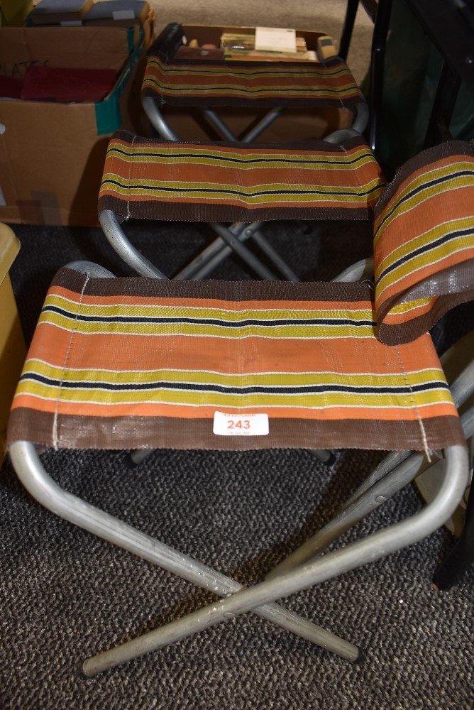 Four retro camping stools.