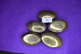 Five brass cast late Victorian snuff or pill case including Engineer North Molton and Abernant