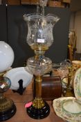 An elegant and fine antique oil burning lamp having fluted and etched shade with Roman column set an