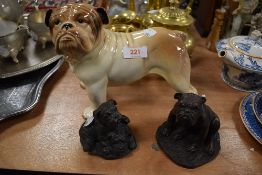 A Melba ware figure of a Bull terrier and two similar