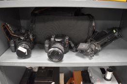 Two Sony cameras. Sony Super Steady Shot with Minolta AF zoom 28-80mm lens, and Sony 18-70 mm, a