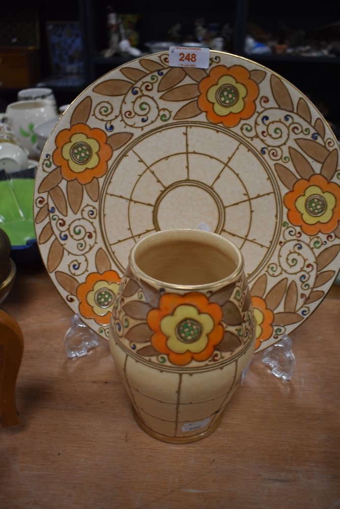 A large Bursley ware charger having trellis pattern, signed Charlotte Rhead and numbered TL3 to