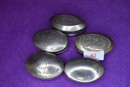 Five metal cast snuff or pill case including Stanleytown and Welsh interest