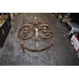 A wrought iron ceiling fixture possibly candelabra or pan rack style