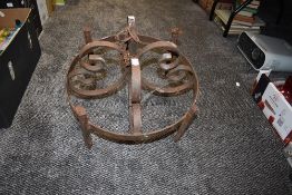 A wrought iron ceiling fixture possibly candelabra or pan rack style