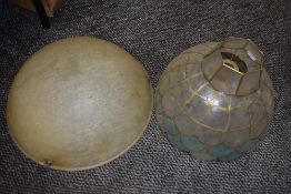 A selection of light shades and milk glass oil lamp globe