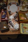 A part tea service by Crown Douglas in an Imari style and a selection of printed tins