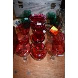 A selection of clear and cut stemmed wine glasses in Jade green and Ruby colours in fine condition