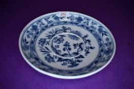 A porcelain plate hand decorated with floral garniture bearing Meissen crossed swords