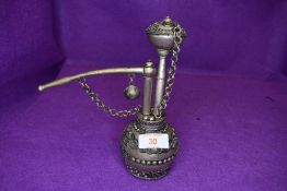 An antique opium smokers pipe having well decorated Indian or Bohemian style design