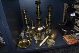 A selection of brass wares including two pairs of candle sticks and miniature versions also