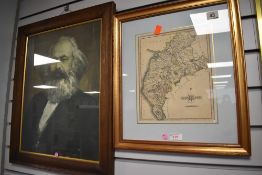 A vintage map print of Cumberland and a similar Russian print of a man