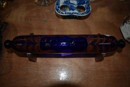 A mid 18th century Bristol blue glass bakers rolling pin having painted decoration and date