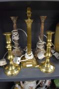 A selection of antique brass cast candle sticks or stems with Roman column design and similar