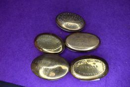 Five brass cast late Victorian snuff or pill containers including Welsh interest