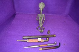 Four antique opium smokers pipes including wooden shafted and similar designs